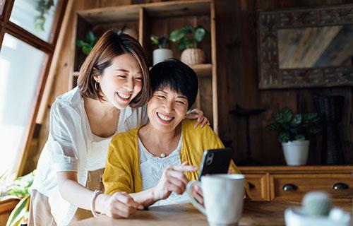 A mother and daughter enjoy a video call